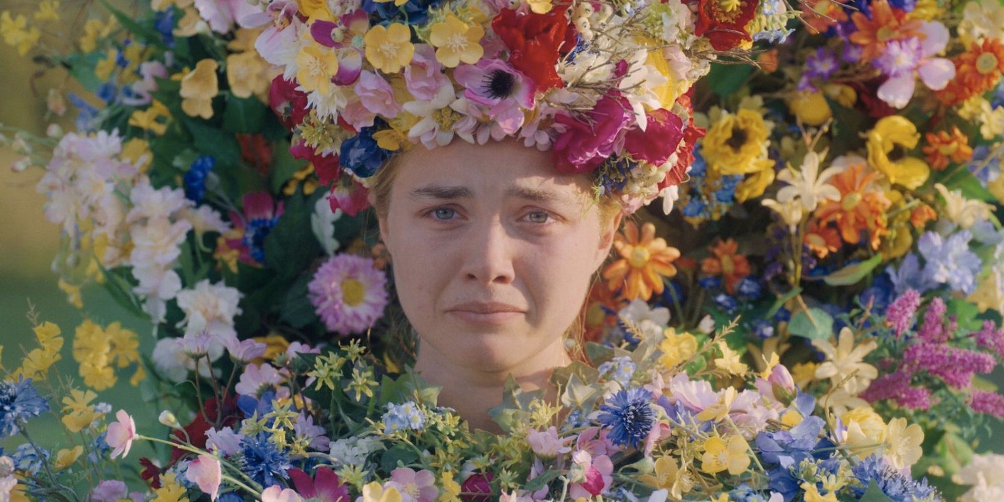 Florence Pugh pouting while surrounded with flowers in 'Midsommar'