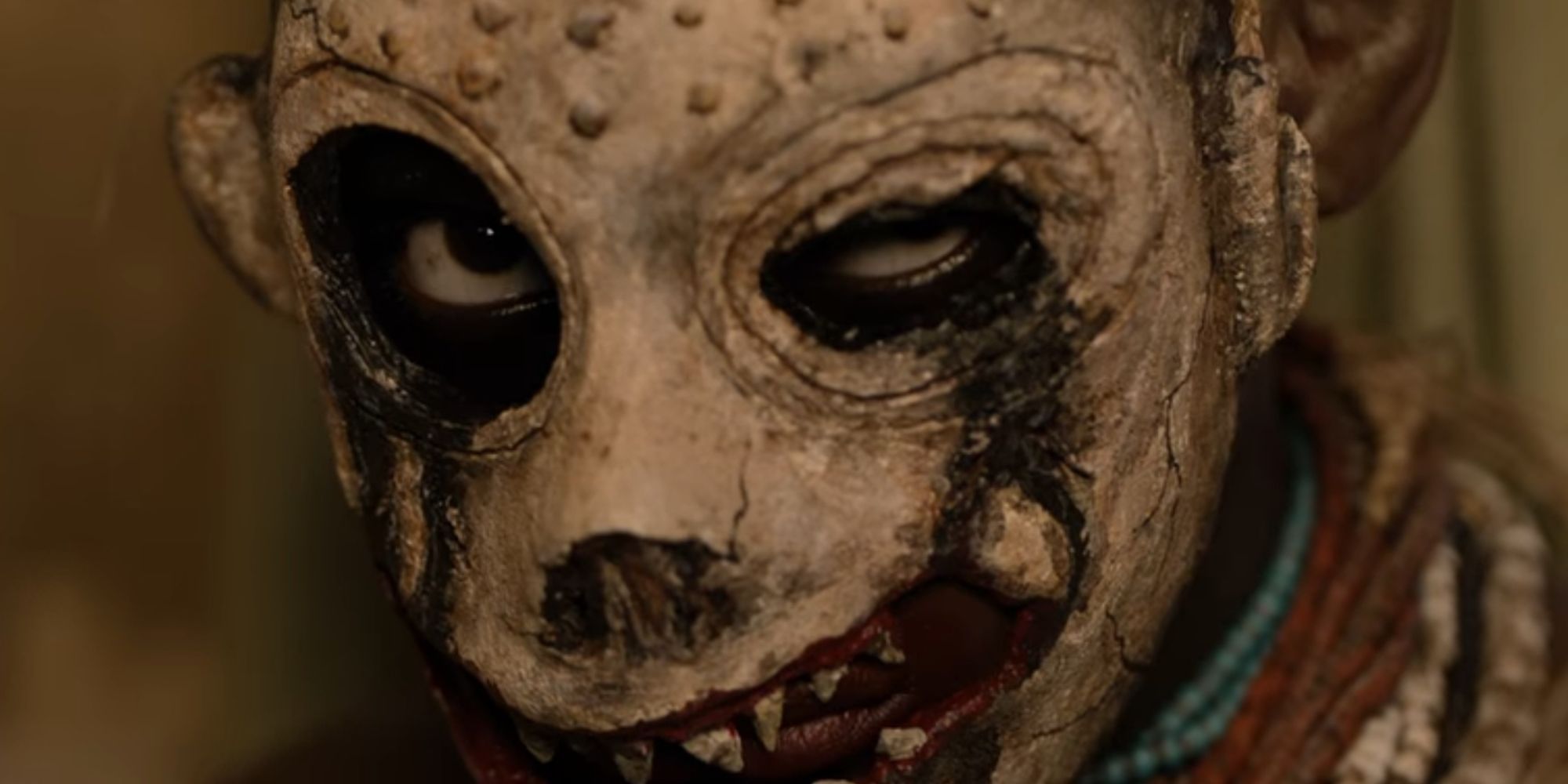 A masked villain in a still from 'His House'